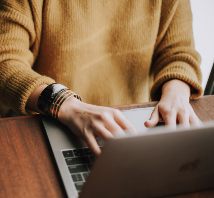 Person typing on laptop